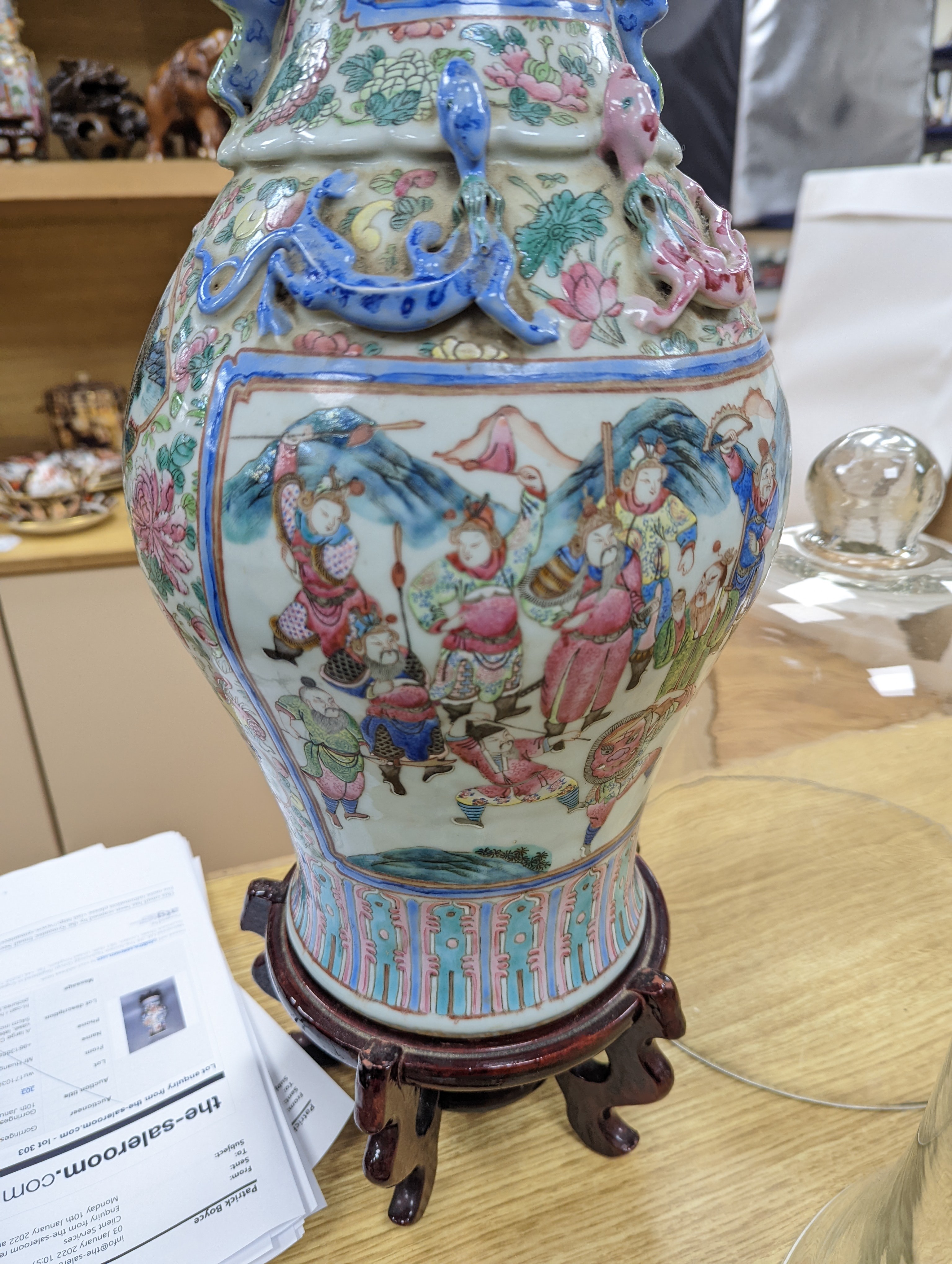 A large Chinese famille rose two handled vase, late 19th century, wood stand, restored 54cm incl stand